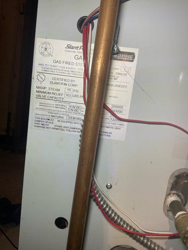 # HVAC Maintenance - Heating System Service Report

Completed Home Plan Annual Inspection on gas-fired heating system. Performed comprehensive maintenance inspection of gas furnace, verifying proper burner operation with all six burner ports producing clean, blue flames indicating optimal combustion and proper air-to-fuel ratio. Inspected heat exchanger for cracks or deterioration, confirmed proper draft, and verified all safety controls functioning correctly.

Inspected Slant/Fin gas-fired steam boiler unit, checking manufacturer specifications and safety ratings (15 PSI MAWP). Examined copper gas line connections, mounting hardware, and pressure relief valve for proper installation and operation. Verified all electrical connections, wiring, and conduit secure and in good condition. Confirmed boiler components operating within manufacturer specifications with no visible leaks or corrosion. Documented equipment condition with photographs for service records. System operating efficientl
