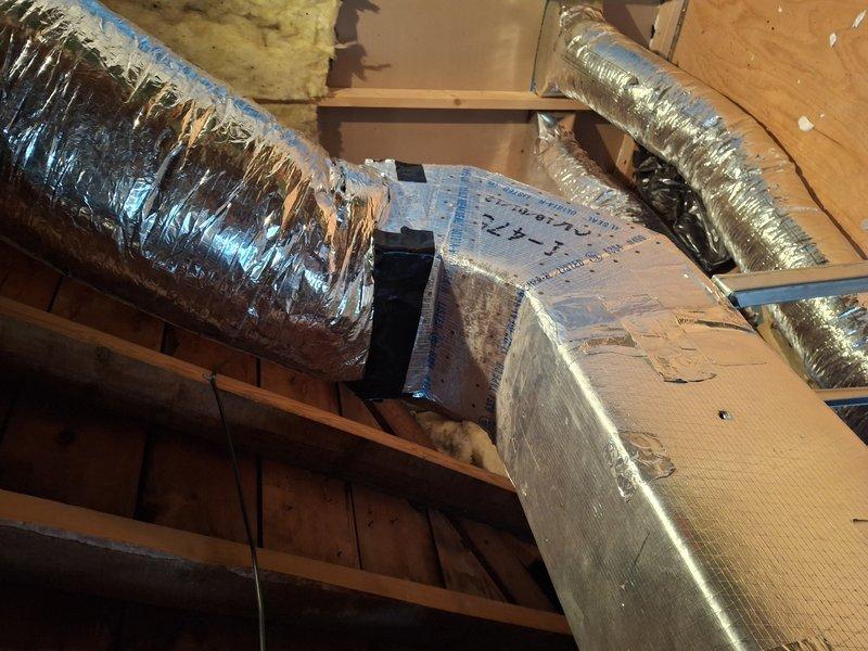 Responded to callback for detached ductwork in attic that had separated from air handler following previous repair visit. Upon arrival, found flexible duct connection had completely detached from air handler unit, which customer had temporarily secured with duct tape to restore heating to entire home. Properly reconnected flexible metallic ductwork to air handler using appropriate fasteners and mastic sealant, ensuring secure attachment and proper airflow distribution throughout the system. Verified all connections were sealed and tested system operation to confirm heating restored to all zones of residence.