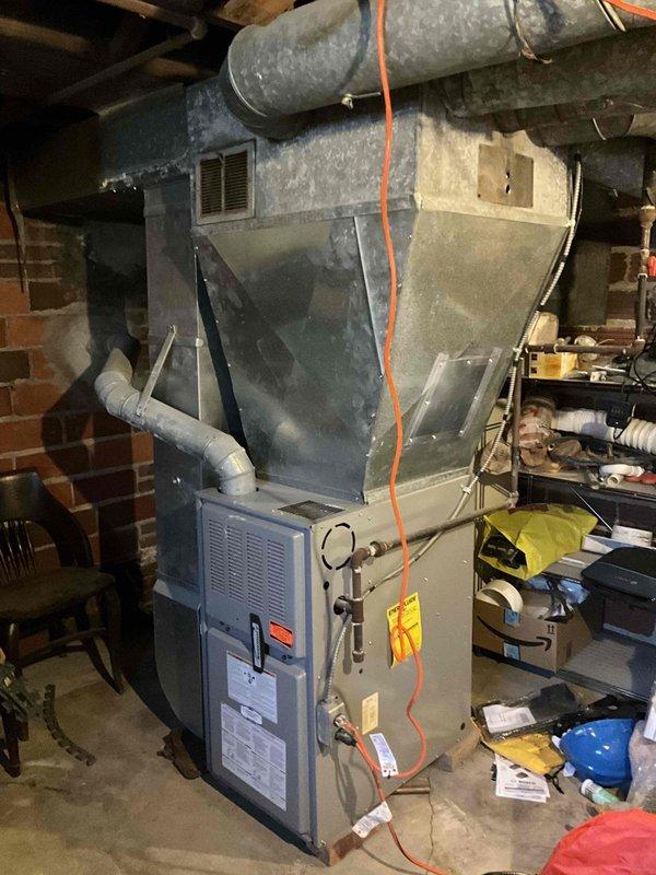 Conducted furnace replacement estimate for residential heating system experiencing no heat condition. Documented existing HVAC equipment installation in basement, including furnace unit, air handler, ductwork, and associated piping systems. Customer notified that required replacement parts will arrive in several days, with installation scheduled to accommodate customer's overnight work schedule.