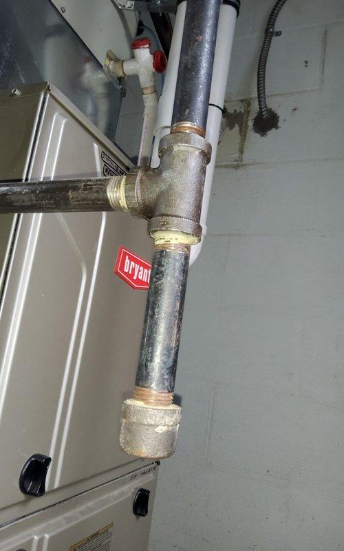 Responded to no heat call on residential furnace system. Upon arrival, performed diagnostic inspection of furnace and associated components. Inspected electrical connections, junction box, and furnace switch to verify proper power supply to unit. Examined gas supply line connections and shutoff valve operation. Checked furnace control board, safety switches, and warning labels for proper functionality. Documented equipment condition with photographs showing utility connections, gas piping, electrical components, and furnace installation near basement brick wall. Verified all mechanical and electrical connections were secure and properly configured. System restored to normal operating condition with heat functioning as designed.