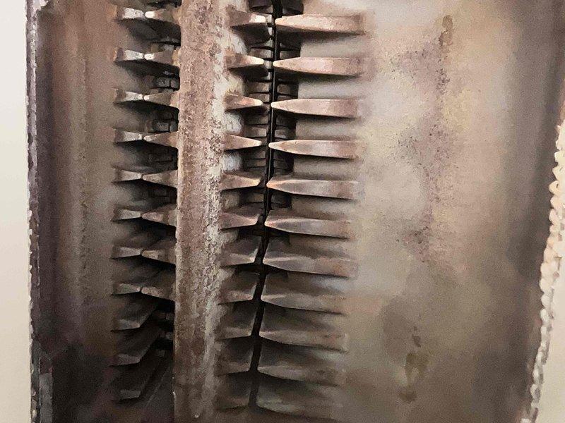 Completed annual Home Plan inspection on steam boiler system. Performed comprehensive examination of heat exchanger components, burner assembly, and internal mechanical systems. Heat exchanger fins showed significant accumulation of dust, debris, and surface oxidation requiring attention during next maintenance cycle. All burner rollers and mounting hardware inspected and found to be structurally sound with normal wear patterns on protective coatings. System operational and safe for continued use.
