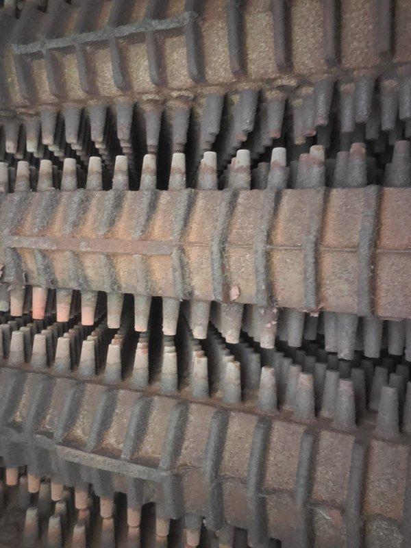 Completed scheduled maintenance on a 5-year-old steam boiler system as part of a recurring home plan service. Upon inspection, heat exchanger fins and evaporator coils showed significant accumulation of dust and debris throughout the assembly, with heavy particulate buildup coating the horizontal fin surfaces and restricting airflow between corrugated metal sections. Performed thorough cleaning of heat exchanger components, removing accumulated dust and debris from finned surfaces and copper tubes to restore proper heat transfer efficiency and system performance. Documented equipment condition with photos showing before-condition of fouled components. System operational following maintenance completion.