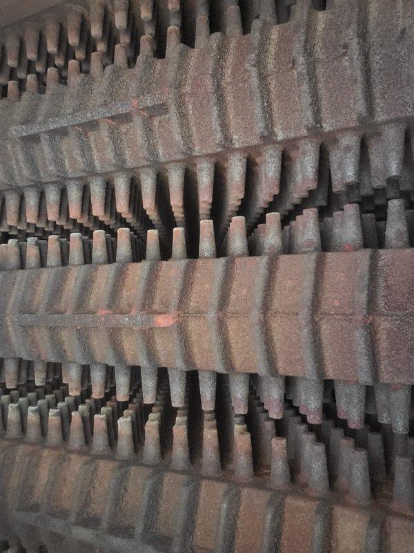 Completed scheduled maintenance on a 5-year-old steam boiler system as part of a recurring home plan service. Upon inspection, heat exchanger fins and evaporator coils showed significant accumulation of dust and debris throughout the assembly, with heavy particulate buildup coating the horizontal fin surfaces and restricting airflow between corrugated metal sections. Performed thorough cleaning of heat exchanger components, removing accumulated dust and debris from finned surfaces and copper tubes to restore proper heat transfer efficiency and system performance. Documented equipment condition with photos showing before-condition of fouled components. System operational following maintenance completion.