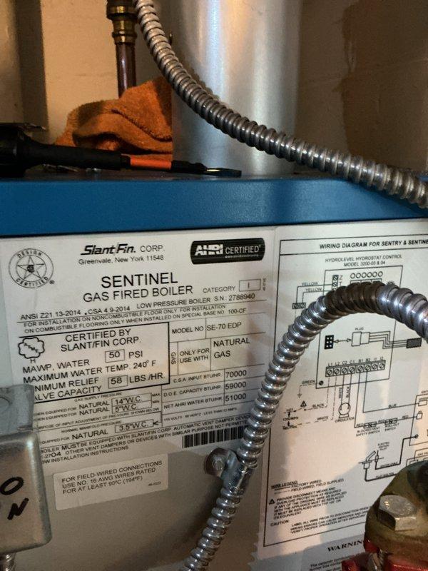 Completed comprehensive tune-up and maintenance service on two gas-fired boiler systems. Primary unit serviced was a Slant/Fin Sentinel SE-70 EDP gas-fired boiler. Performed standard maintenance protocol including combustion analysis, temperature differential testing across supply and return lines, inspection of gas connections and flexible conduits, verification of relief valve settings and maximum operating parameters, and visual inspection of all associated piping and controls. Documented system operating temperatures and confirmed proper functionality of both heating units.