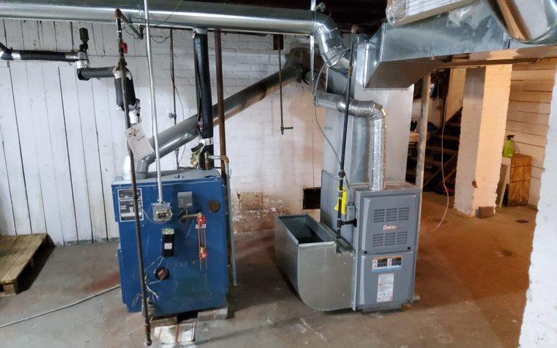 Responded to service call for inspection of newly installed furnace system that was completed by another contractor without proper permitting. Performed thorough visual inspection of furnace installation, ductwork connections, venting system, and associated piping to verify compliance with manufacturer specifications and safety standards. Documented installation conditions with photographs showing gray HVAC furnace unit with metallic ductwork, blue water heating equipment, copper and black piping connections, and flexible metal conduit. Assessed workmanship quality, proper equipment clearances, condensate drainage setup with collection pan, and overall system configuration in basement mechanical room. Coordinated with management regarding permit concerns and determined appropriate next steps for customer given circumstances of unpermitted installation by third-party contractor.