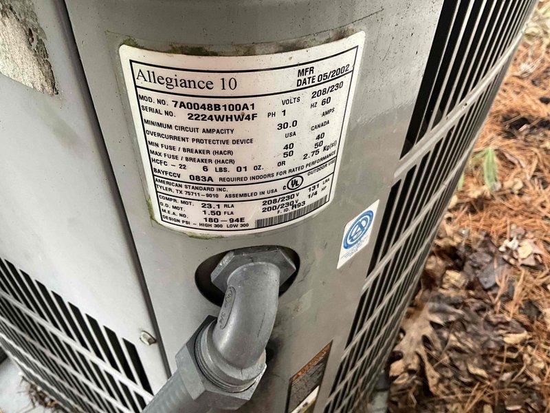 Completed HVAC replacement estimate for a 24-year-old Carrier air conditioning system, including evaluation of both the indoor air handler unit located in the basement mechanical room and the outdoor Allegiance 10 condenser unit (Model 7A0048B100A1, SEER 10.0, manufactured 05/2002). Documented existing equipment conditions with photographs and confirmed customer contact information for proposal delivery.