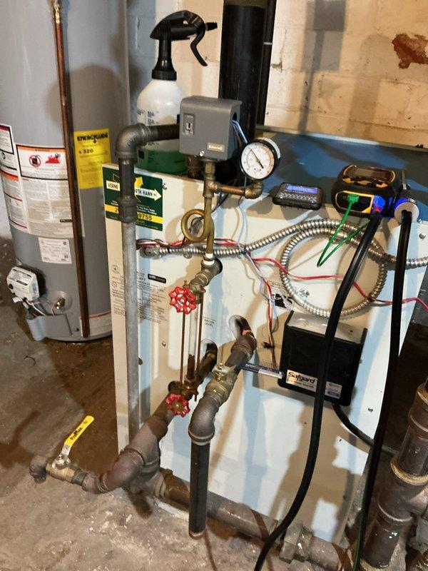 Completed annual maintenance on 8-year-old residential steam boiler system. Performed comprehensive combustion analysis using digital analyzer, recording flue gas temperature, CO2 levels, and system efficiency parameters. Inspected all safety controls, pressure gauge operation, shut-off valves, and piping connections. Verified proper water level, cleaned and tested low water cutoff, and examined all electrical connections and control board functionality. System operating within manufacturer specifications with no deficiencies noted.