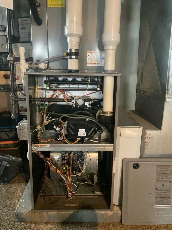 Completed comprehensive air conditioning tune-up on 5-year-old residential system. Performed indoor furnace inspection, verified blower motor operation, checked electrical connections and wiring throughout unit. Utilized digital manifold gauges at outdoor condenser unit to measure refrigerant pressures and temperatures, confirmed system operating within manufacturer specifications with proper charge levels and performance parameters.