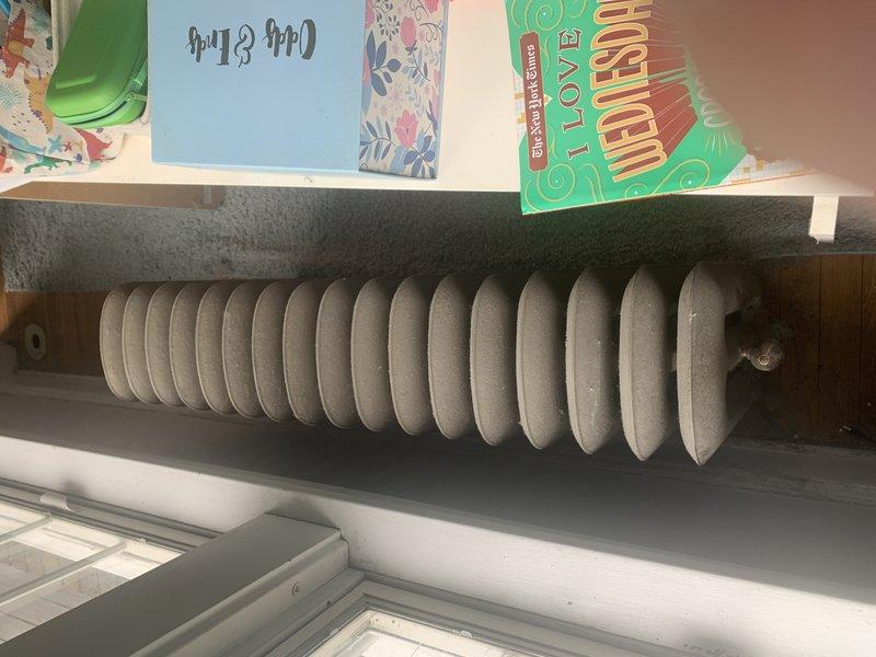 Conducted on-site estimate for boiler system replacement. Documented existing heating distribution system including cast iron radiators and baseboard radiators throughout residence, noting accumulation of dust and debris on heating units requiring attention during installation phase.