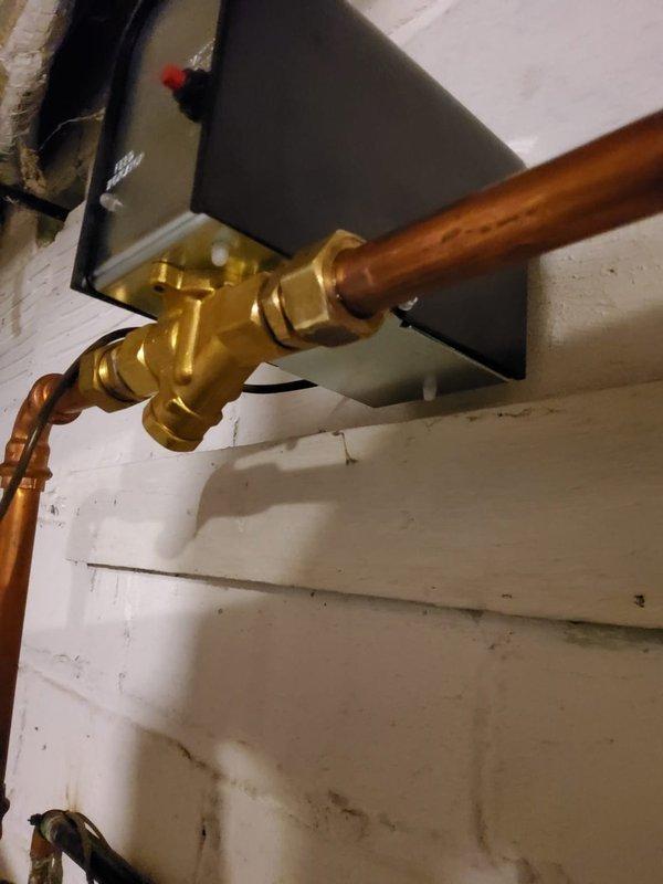 Responded to boiler service call regarding water supply and auto-feeder valve concerns. Upon inspection, diagnosed failed water supply valve assembly. Removed defective brass valve fitting with damaged seals and replaced with new component, restoring proper water feed to the boiler system and resolving the issue reported by both landlord and tenant.