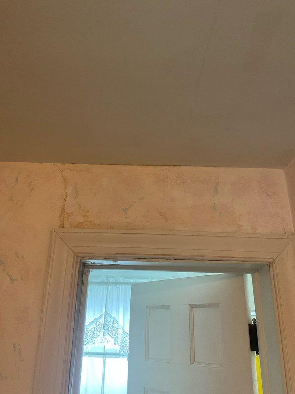 Responded to a plumbing leak in a third-floor bathroom of a 50-year-old home. Upon arrival, documented water damage to ceiling and wall surfaces below the affected area, showing discoloration and moisture staining on drywall and paint. Accessed attic crawl space above bathroom and identified source of leak in aging copper supply line showing significant corrosion and mineral deposit buildup. The corroded section exhibited white crusty accumulation indicating long-term moisture exposure and oxidation. Shut off water supply using existing shutoff valve, removed damaged section of copper piping, and installed new copper pipe section with proper fittings and solder joints. Pressure tested repair to ensure no additional leaks. Advised homeowner that ceiling and wall surfaces will require drying time before cosmetic repairs can be completed, and recommended monitoring for additional plumbing issues given the age of the home's plumbing system and visible oxidation on other copper lines in the