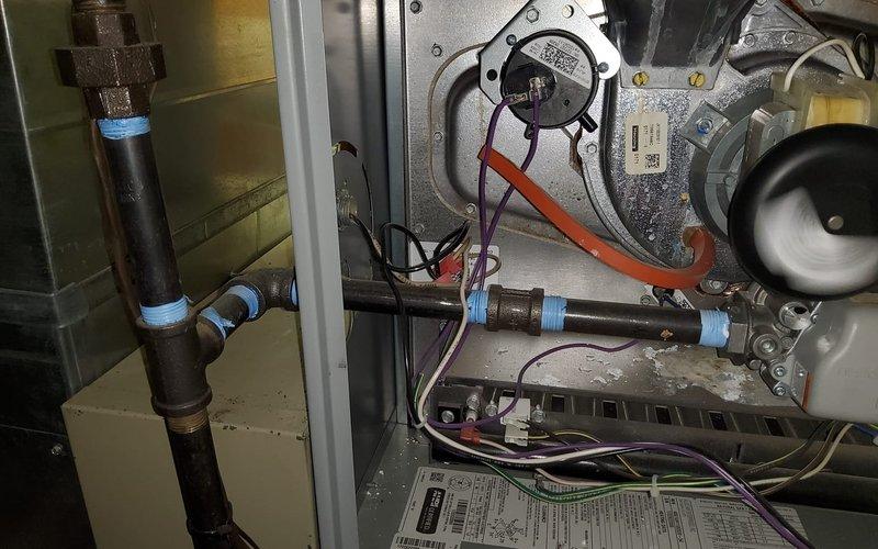 Completed comprehensive maintenance service on both three-year-old furnace and air conditioning systems. Performed interior inspection of furnace cabinet, including blower motor assembly, electrical connections, and gas line components; verified all wiring connections secure and control board operational. Conducted exterior AC condenser unit inspection and cleaning on Lennox unit; performed standard diagnostic testing and verified proper operation of both systems with no issues identified.