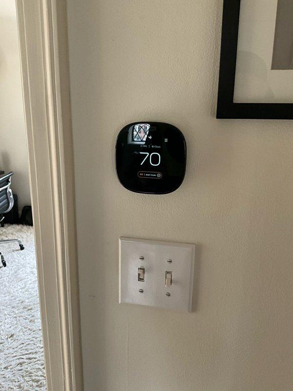 Completed installation of 18,000 BTU ductless mini-split system with indoor head unit mounted on dining room exterior wall. Installed air handler in third floor alcove with ductwork routed through second floor ceiling perimeter, return air pulled from second floor hallway, and smart thermostat positioned in hallway for central control. All equipment tested and operational upon completion.