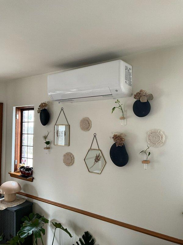Completed installation of 18,000 BTU ductless mini-split system with indoor head unit mounted on dining room exterior wall. Installed air handler in third floor alcove with ductwork routed through second floor ceiling perimeter, return air pulled from second floor hallway, and smart thermostat positioned in hallway for central control. All equipment tested and operational upon completion.