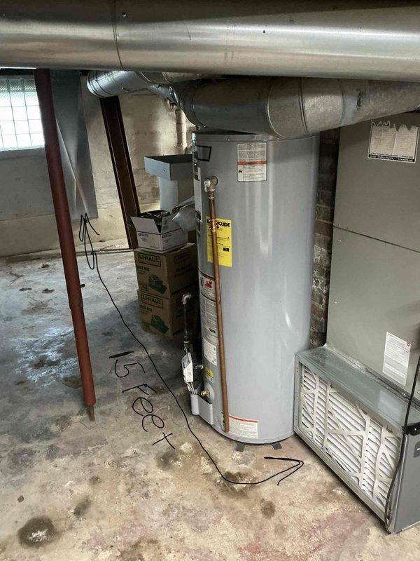Responded to no heat call and performed comprehensive assessment of existing HVAC system in basement mechanical room. Evaluated aging Trane furnace unit showing signs of wear and operational deficiency, along with associated ductwork, water heater, and plumbing connections. Documented equipment condition through detailed photography, noting furnace specifications, ductwork configuration, and overall system layout. Provided estimate for complete furnace replacement to restore heating functionality to the residence.