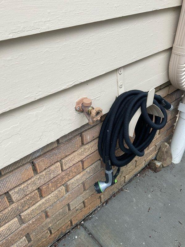 Responded to service call for broken outdoor water spigot at century-old residential property. Upon inspection, found failed exterior hose bib requiring replacement due to age-related deterioration and freeze damage typical of older plumbing systems. Removed defective spigot assembly and installed new brass ball valve with lever handle for improved shutoff control and durability. Connected valve to existing copper supply line using appropriate compression fittings and flexible connector to accommodate seasonal expansion and contraction. Tested system for proper operation and verified no leaks at connection points. Advised homeowner on seasonal winterization procedures to prevent future freeze damage to exterior plumbing fixtures.