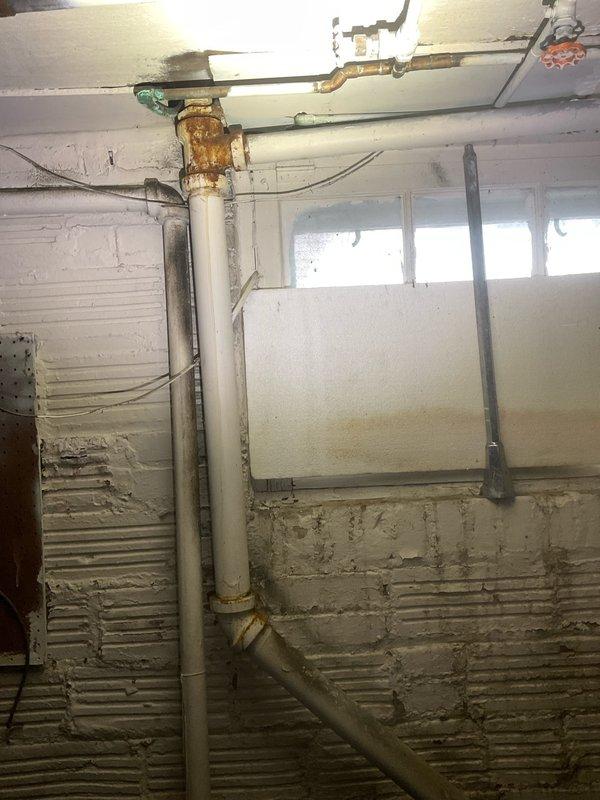 Responded to kitchen sink backup caused by garbage disposal and dishwasher drainage issues. Upon inspection, found improper drainage configuration under kitchen sink with garbage disposal unit connected to dishwasher drain line and P-trap assembly. Cleared blockage in disposal unit and verified proper water flow through drain system. Tested garbage disposal operation and dishwasher drainage cycle to confirm backup was resolved and all fixtures draining properly without further issues.