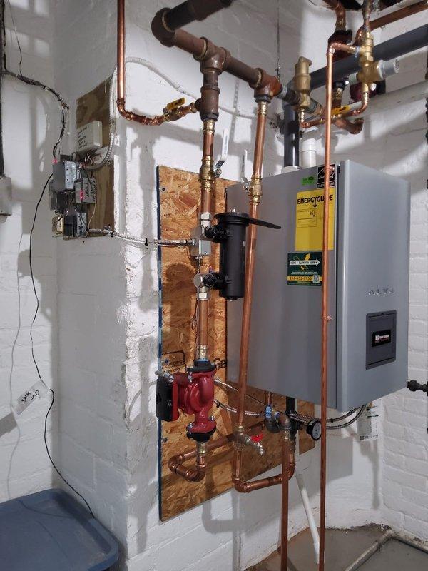 Responded to call back for boiler not running. Checked gas pressure at inlet and throughout system, confirmed proper supply pressure. Bled air from hydronic lines at multiple points including circulator pump and high points in piping network. Verified expansion tank pre-charge pressure and confirmed proper operation. System fired successfully, circulator operating correctly, and heat distribution restored to all zones.