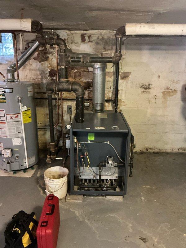 Performed comprehensive routine maintenance on residential gas furnace system. Inspected heat exchanger and burner assembly, confirmed proper ignition and flame characteristics with blue and orange flame pattern indicating efficient combustion. Verified all mechanical components operational, cleaned burner assembly, checked gas connections and exhaust venting for proper operation and safety compliance.