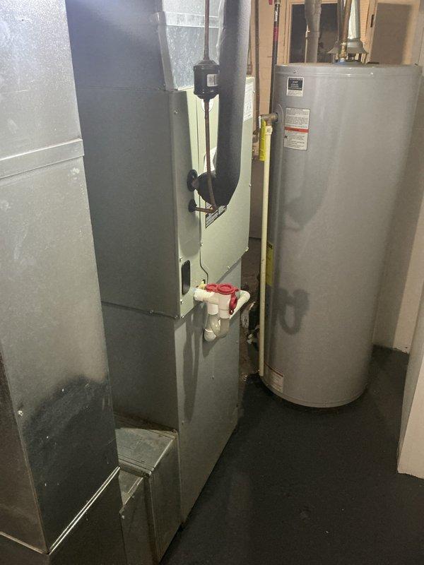 Completed estimate for replacement of ice-damaged air conditioning system in residential mechanical room. Evaluated existing HVAC air handler unit and associated ductwork, condensate drainage systems, and electrical connections to determine replacement requirements. Additionally assessed feasibility of relocating or replacing secondary unit, documenting current equipment configuration including gas piping, PVC drain lines, flex ductwork routing, and electrical panel connections for comprehensive replacement proposal.
