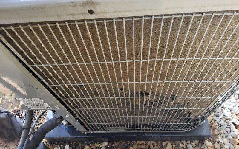 Completed preventive maintenance on two split HVAC systems serving a multi-level residence. Serviced main floor unit including cleaning of heavily soiled outdoor condenser coil with significant dirt and debris accumulation, inspected indoor air handler and ceiling-mounted supply register for proper airflow. Performed similar maintenance procedures on basement system to ensure optimal cooling performance for both zones.