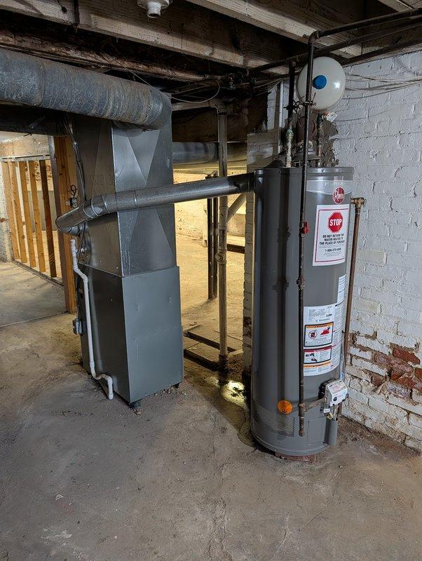 Responded to service call for plumbing modifications and water heater assessment. Removed unnecessary traps and piping from first floor as requested. Capped affected drain lines in basement to code specifications. Inspected existing 6-year-old tanked water heater and identified improper flue pitch creating potential backdraft hazard. Documented equipment condition and venting concerns with photographs. Discussed safety implications of improperly pitched flue with property owner and provided recommendations for water heater replacement to ensure proper venting and code compliance.