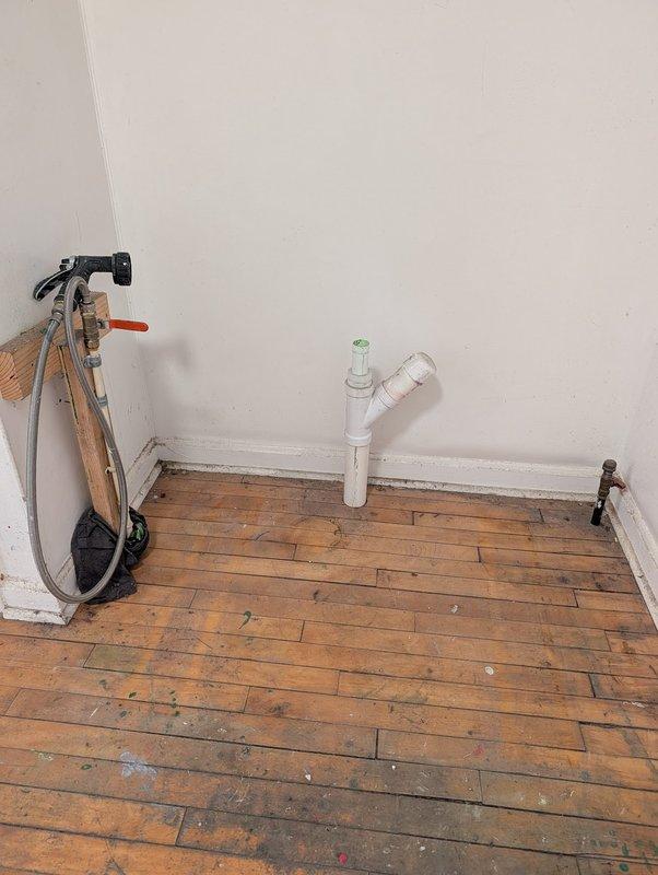 Responded to service call for plumbing modifications and water heater assessment. Removed unnecessary traps and piping from first floor as requested. Capped affected drain lines in basement to code specifications. Inspected existing 6-year-old tanked water heater and identified improper flue pitch creating potential backdraft hazard. Documented equipment condition and venting concerns with photographs. Discussed safety implications of improperly pitched flue with property owner and provided recommendations for water heater replacement to ensure proper venting and code compliance.