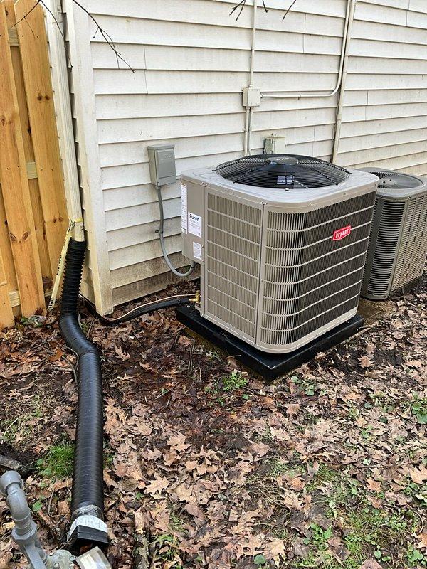 Completed full HVAC system replacement for a 2-story addition, converting from cooling-only to complete heating and cooling. Installed new Bryant furnace with evaporator coil, outdoor condenser unit, and programmable thermostat. Vented furnace exhaust through crawlspace using PVC piping. Reused existing airflow base and integrated air cleaner beneath furnace for improved indoor air quality.

Replaced refrigerant linesets that previously ran under a removed deck, securing new lines to exterior siding and enclosing in line hide for protection and aesthetics. Routed lineset under slider door to maintain proper clearance and appearance. Connected to existing gas supply located near main house boiler system. Installed electrical disconnect and completed all wiring connections to code.

System tested and operational, providing both heating and cooling capabilities to the addition with proper airflow distribution through existing ductwork.