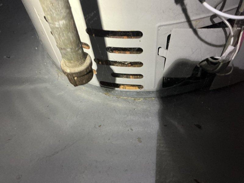 Responded to service call for furnace displaying error code indicating filter maintenance required. Upon arrival, performed system inspection and documented equipment condition. Found significant rust discoloration on internal metal surfaces visible through ventilation slots of drain pan area, indicating potential corrosion concerns. Inspected gas burner assembly, ignition components, gas valve, and control wiring - all appeared operational. Advised homeowner of filter replacement requirement per error code and discussed rust findings observed in base pan area for future monitoring.