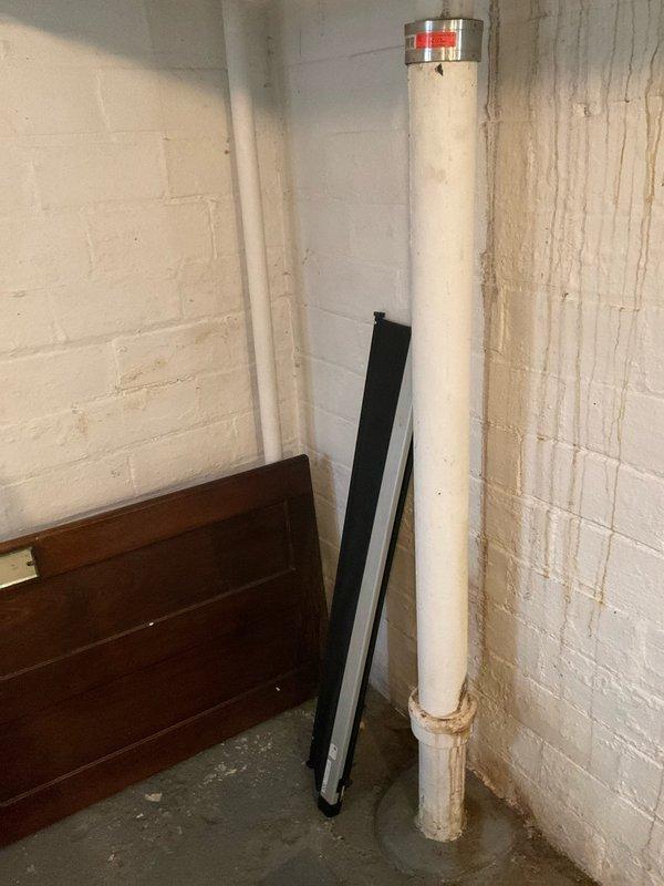 Completed comprehensive plumbing assessment of residential property. Inspection revealed significant water staining on basement utility room walls adjacent to main vertical drain stack, indicating past or active moisture intrusion requiring further investigation. Additionally, evaluated toilet tank components and flush valve assembly, documenting current operational condition of fill valve and flapper mechanism.