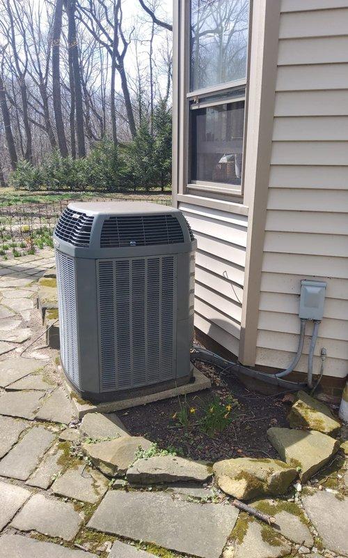 Responded to service call for air conditioning system requiring refrigerant recharge. Upon arrival, performed visual inspection of outdoor condensing unit and indoor air handler components. Assessed refrigerant levels and system pressures at service ports located near indoor evaporator coil. Confirmed low refrigerant charge through pressure readings and system performance evaluation. Added refrigerant to manufacturer specifications, monitoring gauges throughout charging process to achieve proper subcooling and superheat values. Verified brass service valves and copper refrigerant lines showed no visible signs of leakage. Checked condensate drain line and PVC drainage system for proper operation. Cycled system through complete cooling operation to confirm adequate cooling performance and proper system function. Unit returned to normal operating parameters with appropriate temperature differential across evaporator coil.