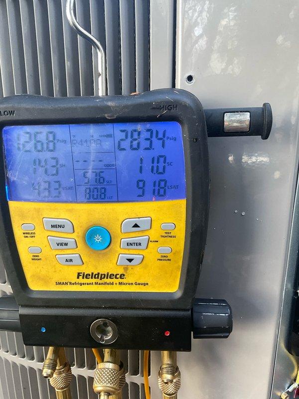 Completed comprehensive cooling maintenance tune-up on three outdoor condensing units servicing residential property. Performed full system diagnostics using refrigerant manifold with micron gauge, recording temperatures, pressures, and operational parameters across all three systems to verify proper refrigerant charge levels and system performance. All units inspected, tested, and confirmed operating within manufacturer specifications.