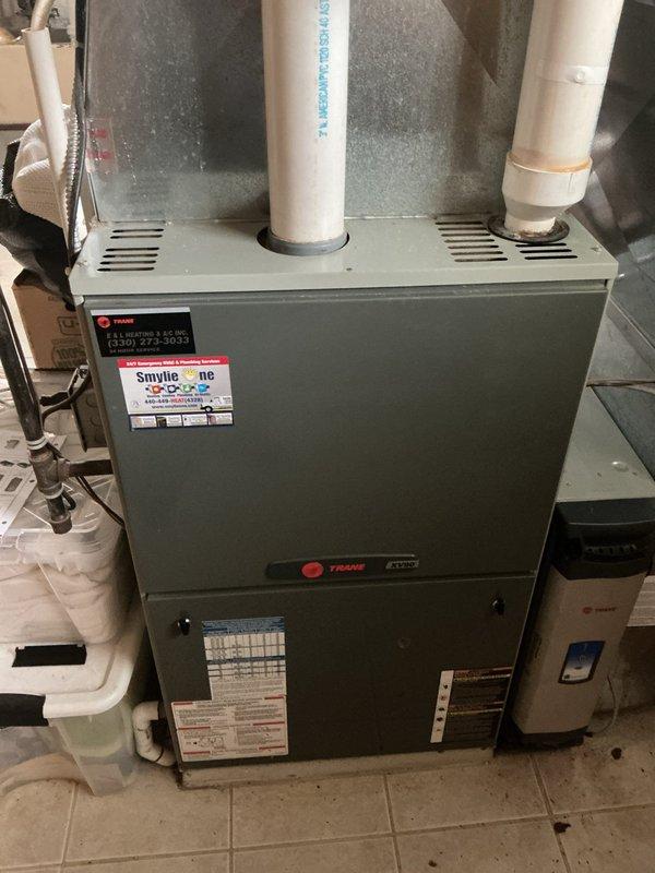 Responded to service call for air conditioning unit requiring refrigerant recharge. Upon arrival, conducted comprehensive system evaluation of existing HVAC equipment. Documented current installation including Trane furnace unit with associated ductwork, PVC condensate drainage system, and connected components. Performed visual inspection of mechanical room setup, noting equipment configuration and accessibility. Photographed existing system components for reference and assessment purposes. Based on findings and system age uncertainty, provided estimate for complete air conditioning system replacement rather than recharge service, as unit condition and specifications warranted full replacement consideration for optimal performance and efficiency.