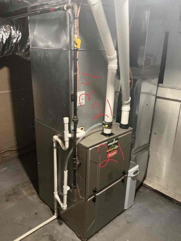 Responded to service call for air conditioning system low on refrigerant. Conducted diagnostic assessment of residential HVAC system located in basement utility area. Evaluated furnace unit, air handler, and associated ductwork and piping connections. Documented existing equipment condition including gas supply lines with shut-off valve, condensate drainage system, PVC venting, and electrical components. Prepared estimate for complete system replacement based on assessment findings.