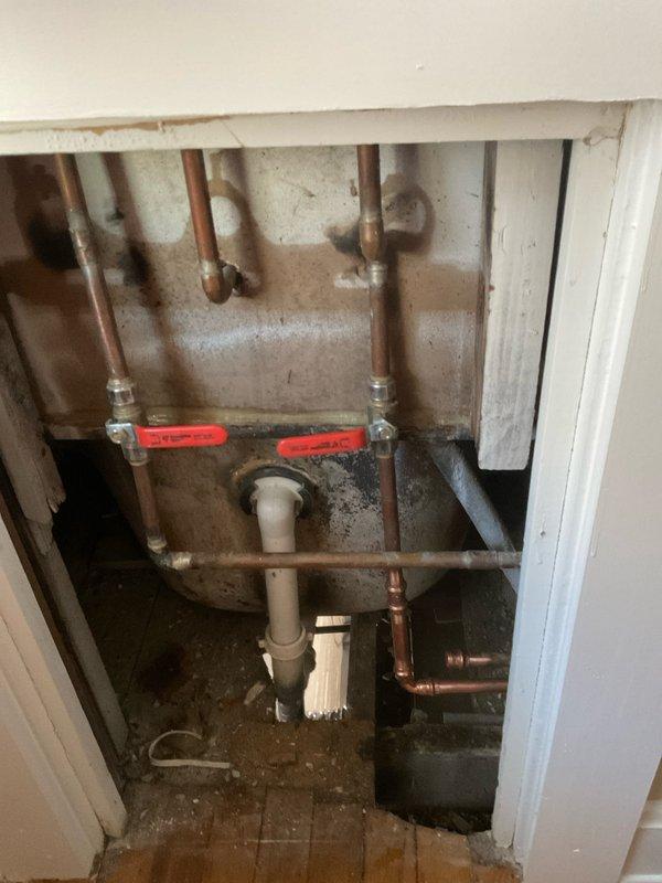 Responded to plumbing system cross-connection issue where cold water line was incorrectly connected to hot water supply. Disconnected the improperly connected cold line from the hot side of the system. Repiped the hot water line correctly to restore proper water supply configuration. Work performed in exposed plumbing compartment with copper supply lines and shut-off valves. System tested and verified operational upon completion.