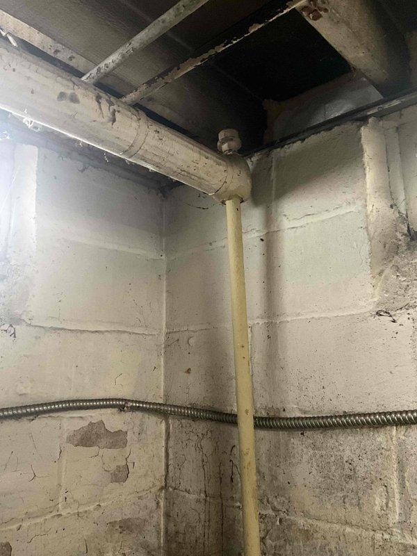 Responded to no heat call for boiler system. Upon arrival, conducted visual inspection of basement mechanical area and documented existing plumbing infrastructure, gas piping, and structural conditions surrounding the heating system. Photographed current installation layout including gas supply lines, venting components, and mounting location to assess equipment accessibility and code compliance requirements for potential boiler replacement or repair recommendations.