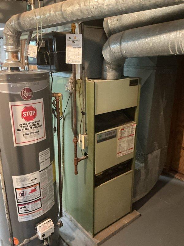 Responded to no heat call on 1979 furnace system. Performed comprehensive assessment of existing HVAC equipment including furnace unit, electrical panel, and associated mechanical systems. Documented current system condition through detailed photographic inspection showing aged furnace cabinet, electrical distribution panel with multiple circuit breakers, water heater installation, and ductwork configuration. Prepared replacement estimate for complete furnace system upgrade due to equipment age and failure to provide adequate heating.