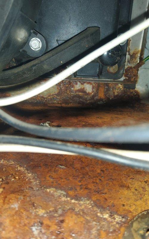 Responded to service call regarding potential carbon monoxide leak identified by gas company. Upon arrival, performed comprehensive safety inspection of Goodman furnace system. Visual examination revealed extensive corrosion and rust damage on heat exchanger components and internal metal surfaces, indicating advanced deterioration from prolonged moisture exposure. The corrosion exhibited heavy oxidation with pitting and flaking, particularly on critical heat exchanger surfaces where structural integrity is essential for safe operation. This level of deterioration creates pathways for combustion gases, including carbon monoxide, to escape into the living space rather than being properly vented. Documented all findings with photographs showing corroded components and overall unit condition. Confirmed gas company's assessment that furnace poses carbon monoxide safety hazard due to compromised heat exchanger. Advised customer that unit requires immediate replacement as heat exchanger failu