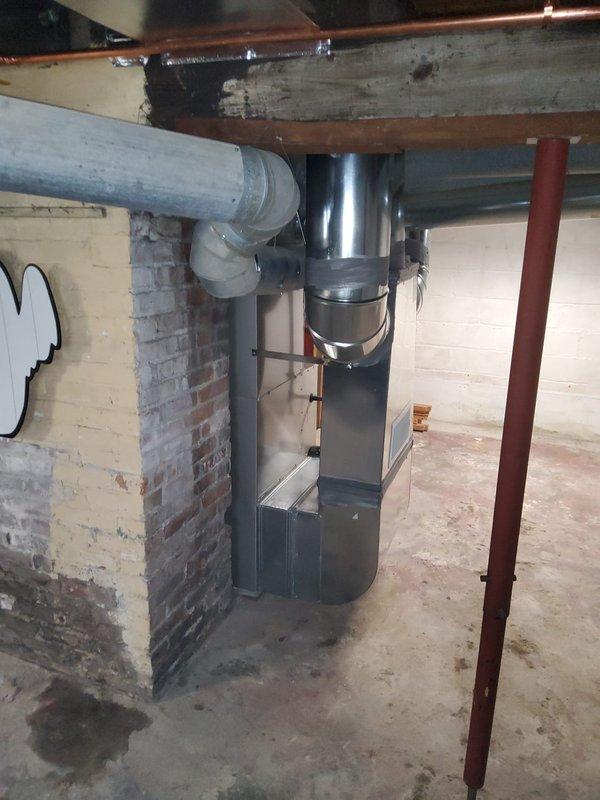 Completed full HVAC system replacement in basement mechanical room, including new furnace, evaporator coil, air conditioning unit, and condensate pump installation. Reconnected and secured cold air return ductwork to new system, installed exterior condenser unit with refrigerant lines and electrical connections, and verified all components operational. System tested successfully with proper airflow, temperature differential, and drainage function confirmed.