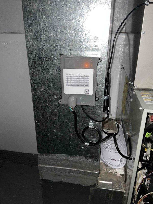 # HVAC System Installation

Successfully completed a full air conditioning and evaporator coil replacement in the mechanical room. Removed the existing system and installed a new CVA1036172MAA40A indoor heat pump/air conditioner section with matching coil assembly. The new air handler unit was properly positioned and secured adjacent to the existing furnace equipment. Installed and wired a new control relay box on the adjacent wall, running appropriate electrical conduits and connections to the main unit. All electrical connections were terminated according to manufacturer specifications and code requirements. Verified proper refrigerant line connections at the coil ports and confirmed all safety labels and documentation were in place. System was tested for proper operation with all indicator lights functioning correctly. Installation meets UL certification standards and manufacturer's minimum clearance requirements.