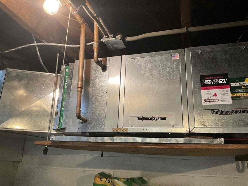 Conducted boiler estimate after detecting elevated carbon monoxide levels during inspection. Thorough examination revealed heat exchanger in severely deteriorated condition, posing immediate safety hazard and requiring system replacement. Documented equipment condition with photographs showing existing HVAC infrastructure including Unico System components, ductwork, water heater, and associated plumbing connections for replacement planning purposes.