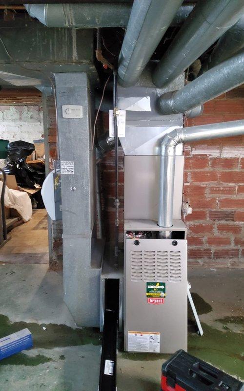 Completed annual maintenance on one-year-old gas furnace and air conditioning system in basement utility area. Performed comprehensive inspection of furnace components including blower wheel assembly, verified proper operation of forced-air heating system, checked all ductwork connections and insulation integrity, and inspected gas line connections and electrical components. Conducted preventive maintenance on A/C system per manufacturer specifications, cleaned blower wheel of dust accumulation, verified all safety labels and warning stickers were intact, and confirmed both heating and cooling systems are operating within normal parameters for continued reliable performance.