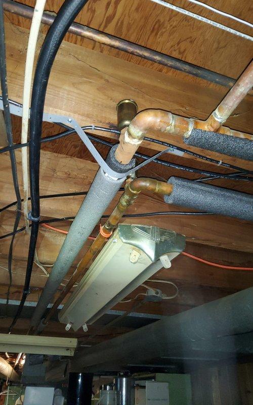 Responded to service call for noisy furnace and boiler systems in residential property. Performed comprehensive diagnostic evaluation on aging Lennox furnace (approximately 43 years old) and boiler system (approximately 30 years old) to identify source of rattling noises reported by homeowner.

Conducted thorough inspection of furnace unit, including examination of blower assembly, heat exchanger, burner components, and all mechanical connections. Inspected ductwork system and plenum connections for loose fasteners or vibration points. Evaluated boiler system, checking circulator pump, zone valves, expansion tank, pressure relief valve, and all piping connections for mechanical wear or loose components that could generate noise during operation.

Assessed condition of copper piping, brass fittings, and support brackets throughout both systems. Examined flexible ductwork connections and metallic duct joints for proper securing. Verified all electrical connections, wiring, and control co