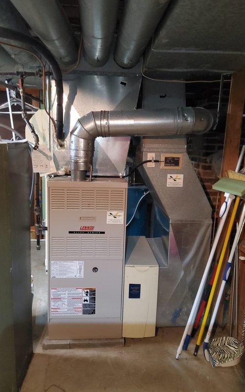 Responded to service call for noisy furnace and boiler systems in residential property. Performed comprehensive diagnostic evaluation on aging Lennox furnace (approximately 43 years old) and boiler system (approximately 30 years old) to identify source of rattling noises reported by homeowner.

Conducted thorough inspection of furnace unit, including examination of blower assembly, heat exchanger, burner components, and all mechanical connections. Inspected ductwork system and plenum connections for loose fasteners or vibration points. Evaluated boiler system, checking circulator pump, zone valves, expansion tank, pressure relief valve, and all piping connections for mechanical wear or loose components that could generate noise during operation.

Assessed condition of copper piping, brass fittings, and support brackets throughout both systems. Examined flexible ductwork connections and metallic duct joints for proper securing. Verified all electrical connections, wiring, and control co