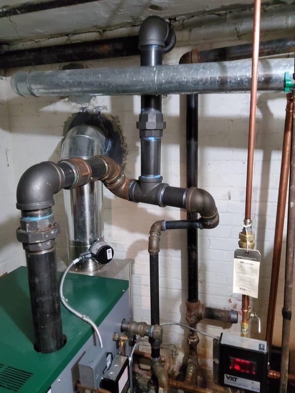 Replaced defective boiler piping in mechanical room, installing new copper pipe runs with appropriate fittings to restore proper system operation. All connections were properly soldered and tested, with expansion tank and associated components reconnected to ensure reliable hydronic heating system performance.