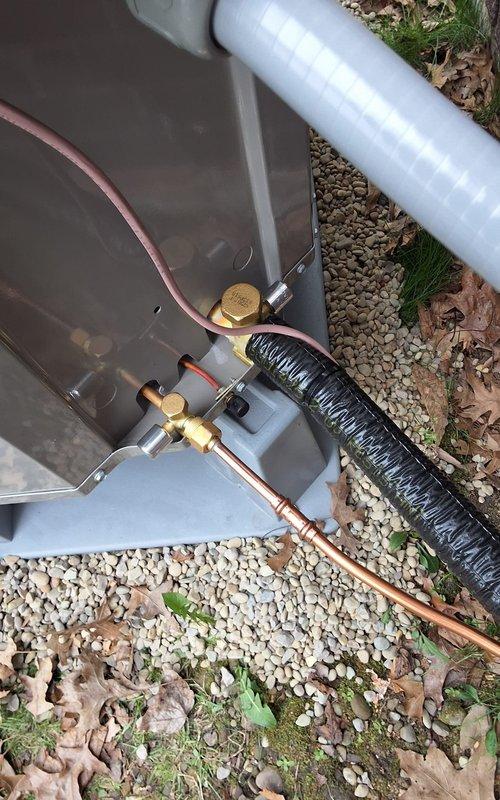 Completed full HVAC system installation including new furnace, evaporator coil, add-on heat pump, refrigerant line set, electrical service, and Ecobee thermostat. Installed outdoor heat pump unit on gravel pad with proper copper line set connections and disconnect box mounted on exterior wall. Ran new electrical conduit and wiring from main panel to outdoor unit, ensuring code-compliant installation with appropriate overcurrent protection. Installed PVC condensate drain lines with proper pitch and termination point on exterior. All refrigerant lines insulated and secured, system charged to manufacturer specifications, and Ecobee smart thermostat programmed for dual-fuel operation. System tested and verified operational in both heating and cooling modes with proper airflow and temperature differential across coil.