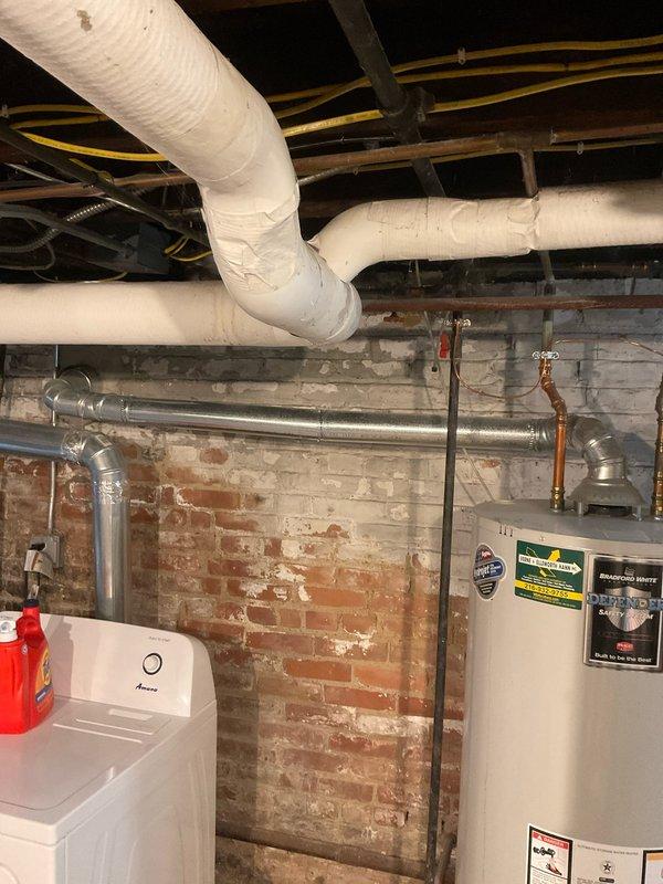 Responded to service call regarding existing Bradford White 48-gallon natural gas water heater (Model BG250T6N) that was previously venting through masonry chimney. Customer discovered venting conflict during chimney removal project. Assessed current atmospheric venting configuration and water heater specifications to provide pricing estimate for power vent conversion kit installation required to maintain safe operation of unit.
