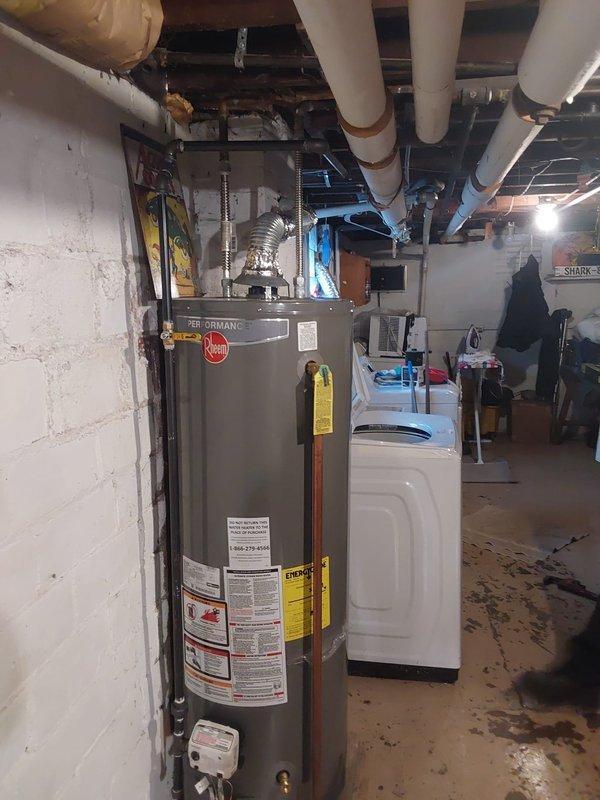 Completed installation of new piping for four plumbing fixtures in basement utility area. Work included routing supply and drain lines through exposed ceiling joists, connecting to existing water heater and washing machine, and ensuring proper venting and drainage for all fixtures per code requirements.