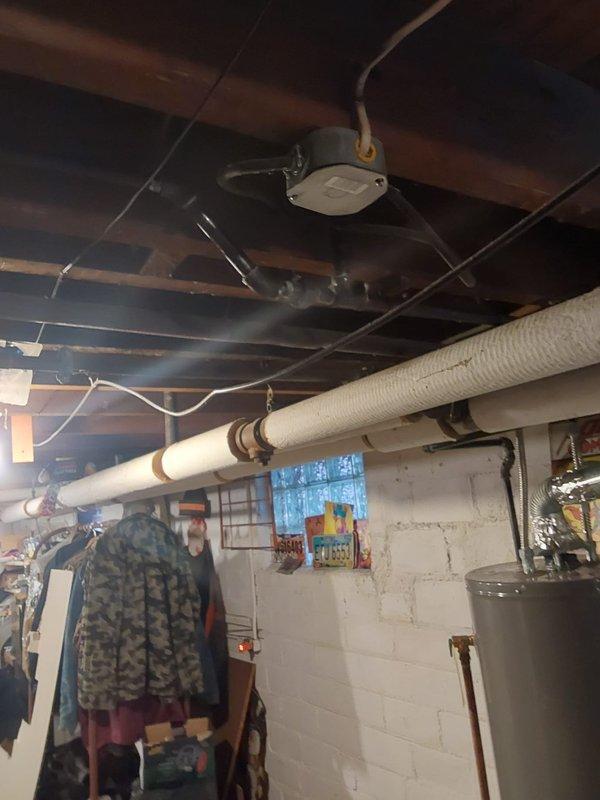 Completed installation of new piping for four plumbing fixtures in basement utility area. Work included routing supply and drain lines through exposed ceiling joists, connecting to existing water heater and washing machine, and ensuring proper venting and drainage for all fixtures per code requirements.