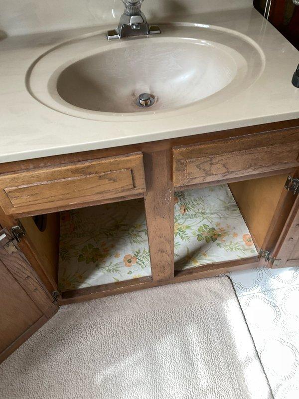 Responded to a plumbing service call for a clogged bathroom sink and loose faucet handle in a 90-year-old residential property. Successfully cleared the drain obstruction in the bathroom sink using appropriate drain cleaning methods to restore proper water flow and drainage. Tightened and secured the loose handle on the downstairs Moen faucet assembly, ensuring proper operation and eliminating wobble or movement during use.